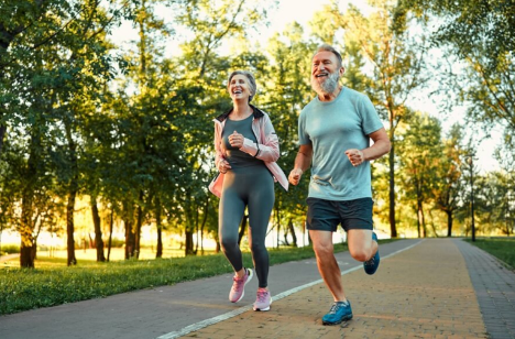 Couple running together outside on a nice day